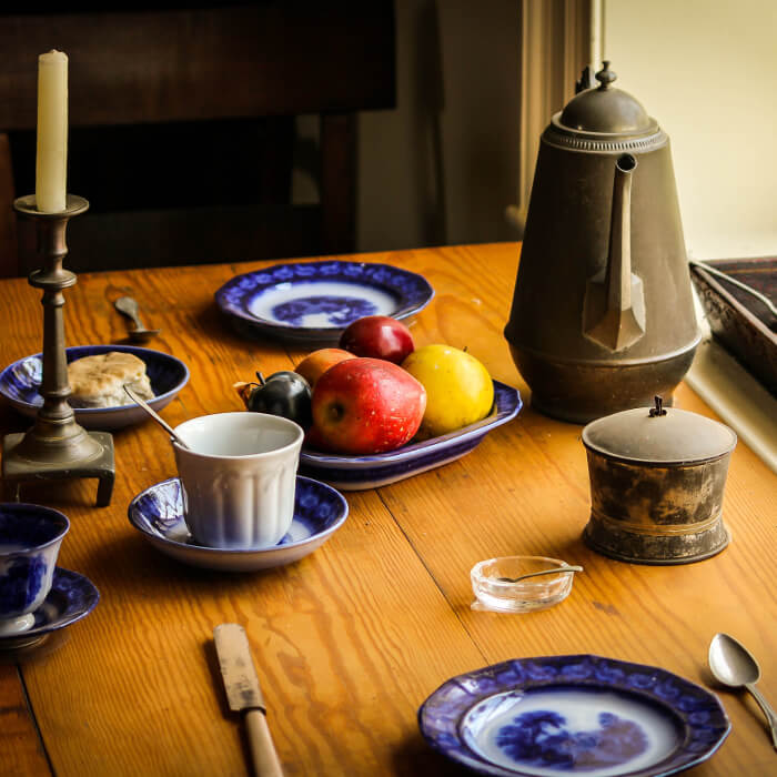 Table with tea service and fruit bowl