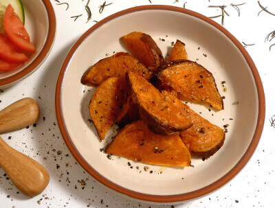 Baked sweet potato wedges on a plate