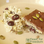 Coconut and nut squares on a serving plate