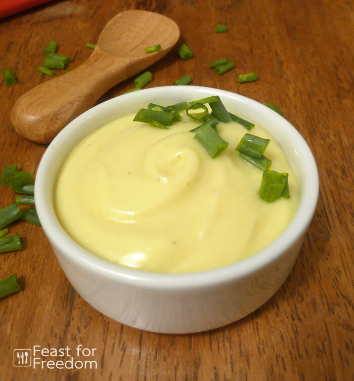 Fresh mayonnaise in a small glass bowl