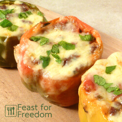 Stuffed peppers with a spicy ground beef filling and topped with melted cheese